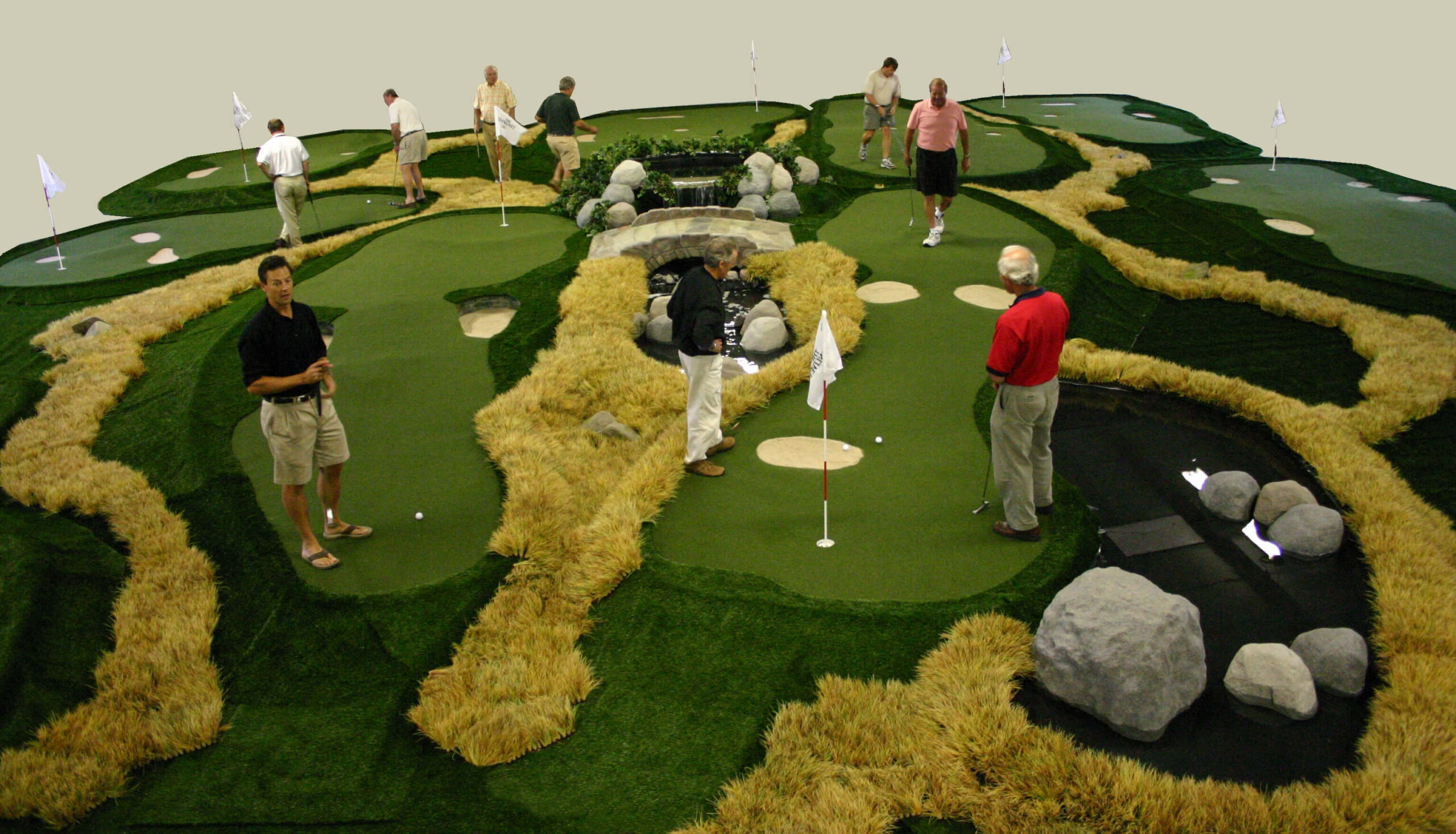 Players on an AGS portable modular mini golf course Glenlivet used as attraction at tasting events