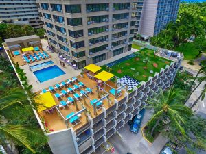 Birdseye view of the rooftop swimming pool, chaise lounges and AGS mini golf and game courts