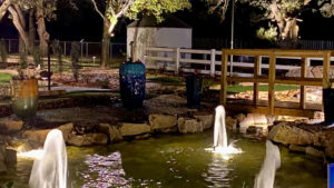 Water features at night on the Cen-Tex Mini Golf course designed and built by Adventure Golf & Sports