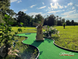 Installed by Redmax rentals, a curvy MiniLinks™ green with a standing windmill obstacle in the middle of the green, the hole placed behind it.
