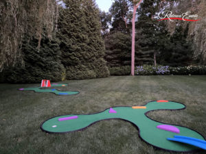 Two separate mini golf holes, showcasing a MiniLinks™ hole with hanging chain-link obstacle and a SplitShot® hole with bridge and obstacles in various shapes.