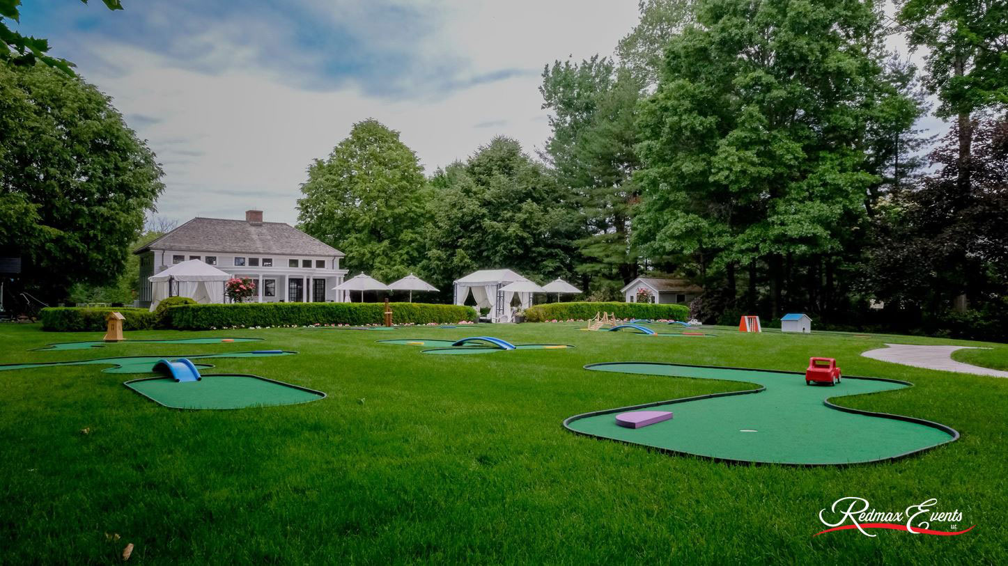 Complete portable mini golf course including both SplitShot® and MiniLinks™ holes installed at a private residence in New Jersey by Redmax rentals.