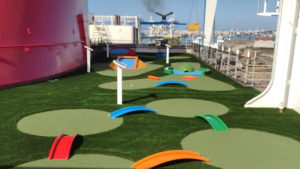 Several miniature golf holes placed along the deck perimeter of the Carnival Radiance Cruise Ship in Venice, Italy.