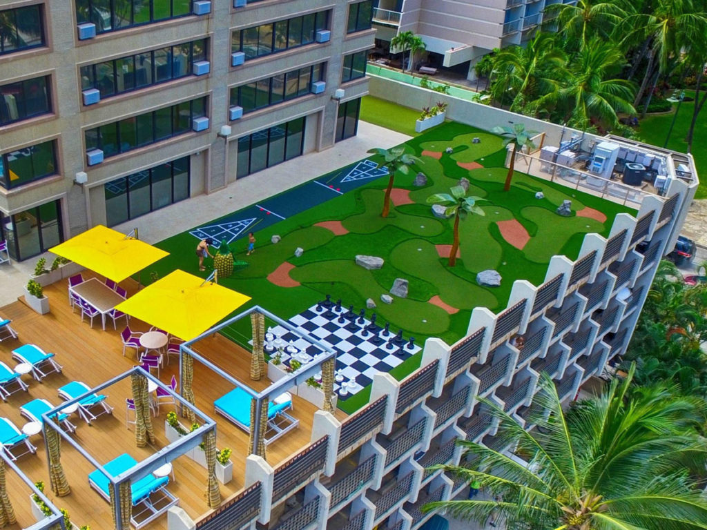 AGS mini golf course, giant chessboard set and shuffleboard court on the roof of a Hawaiian hotel