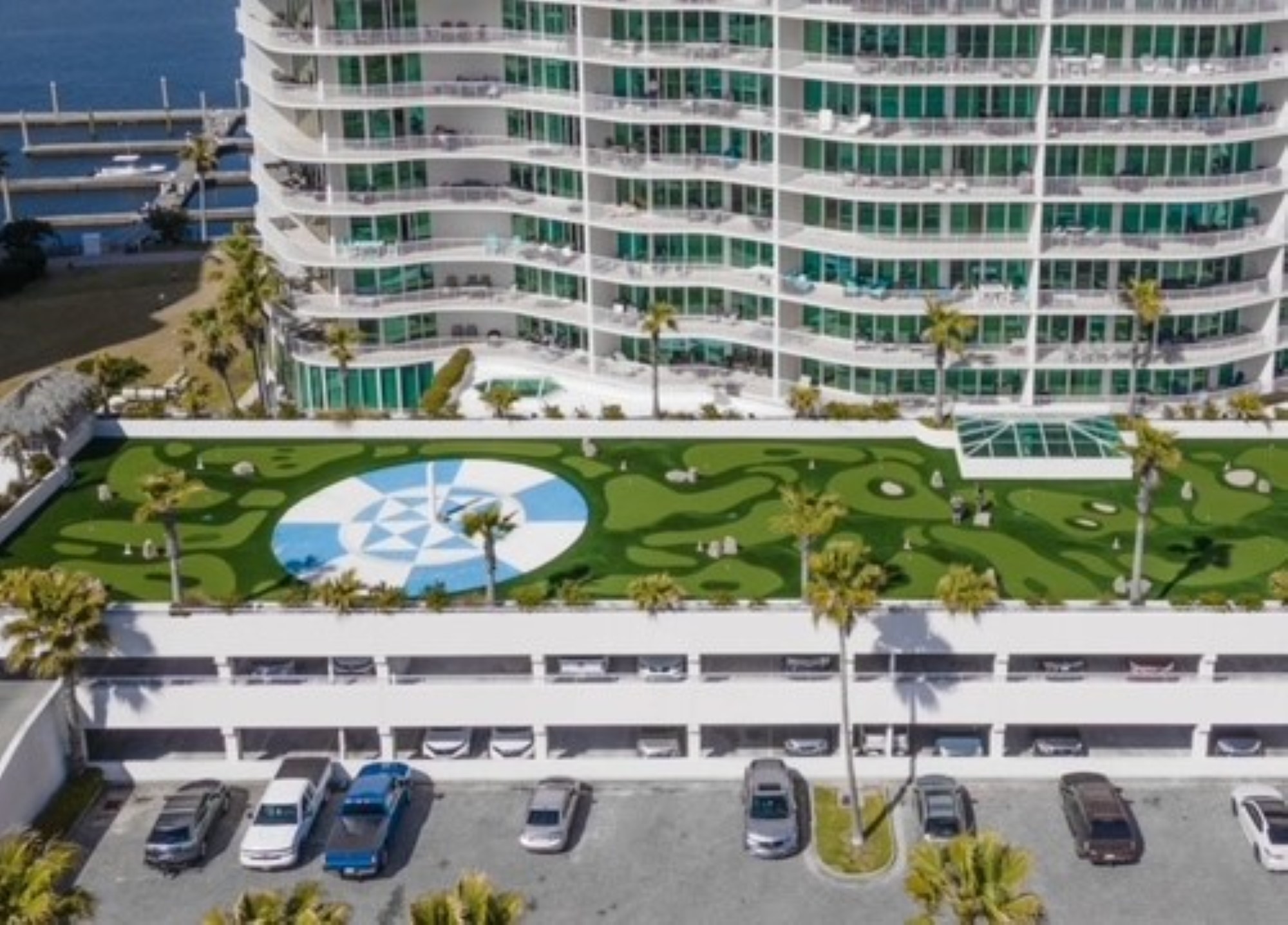 Caribe Resort mini golf course on rooftop of parking deck in front of 14-story guest room tower