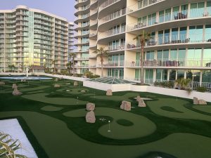 Several of the mini-golf holes on the rooftop of a parking deck at Caribe Resort in Orange Beach, AL