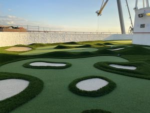 Contours, rough turf and faux sand bunkers adorn the mini golf course on the Princess Emerald