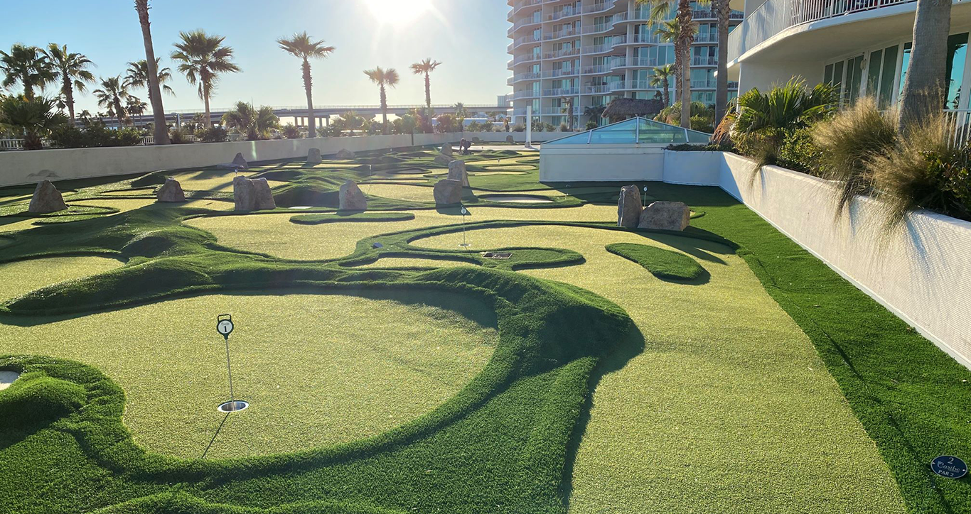 Bright sunshine highlights the Caribe Resort parking deck rooftop mini golf course designed by AGS