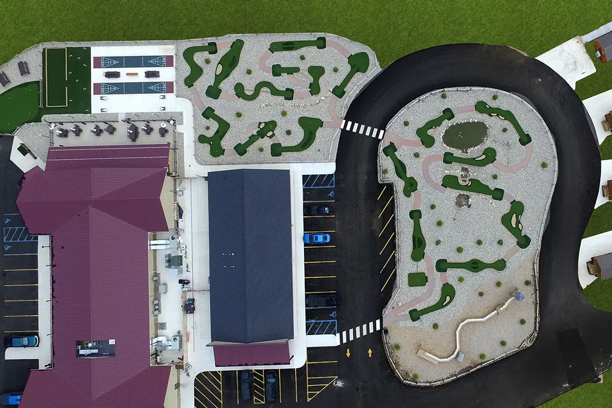 Artist ariel view rendering of AGS mini golf and game courts at Alpen Bluffs Resort in Grayling, MI