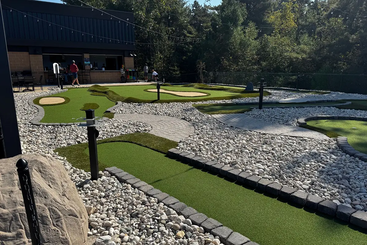 Faux sand traps, sloping terrain and varying turf are typical of AGS Modular Advantage® mini golf courses