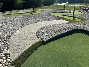 Carefully contoured mini golf holes and paving brick paths are ADA-compliant on this AGS course