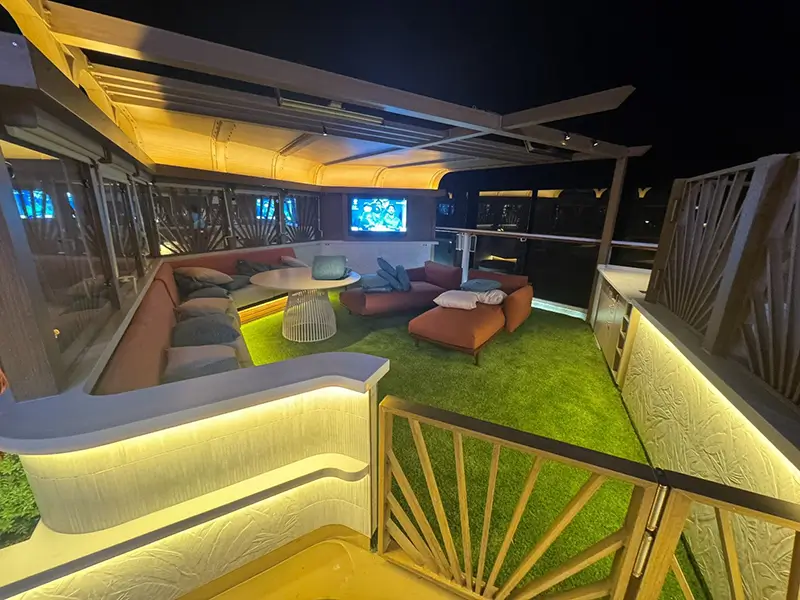 Cozy corner lounging space from AGS features soft turf and special infill to help keep surface cool